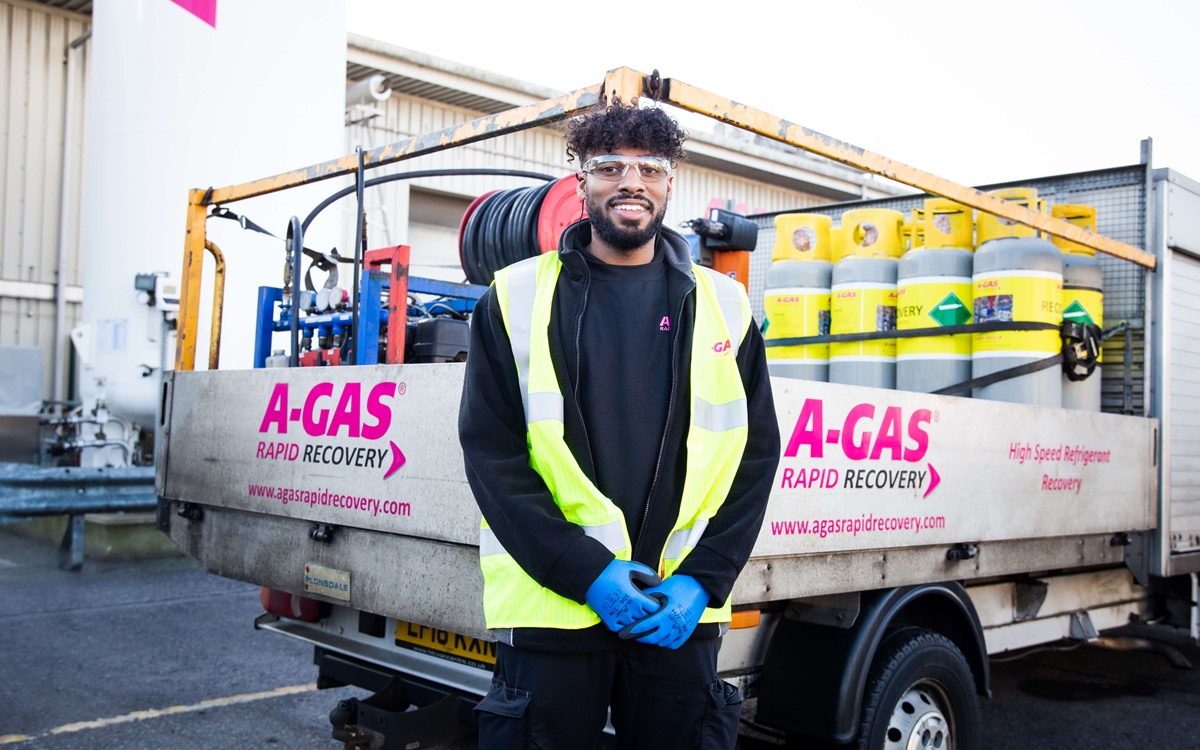recovery engineer standing in front of service vehicle