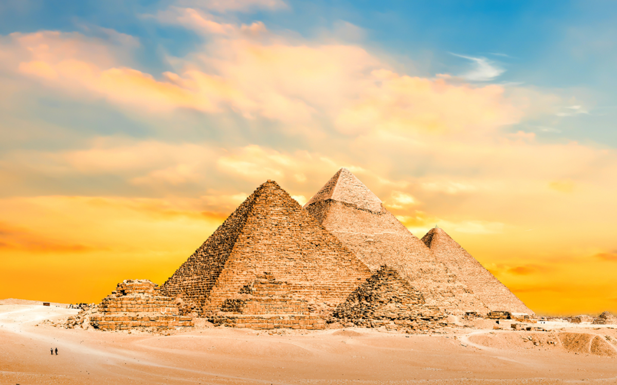 A wide shot of pyramids in the desert