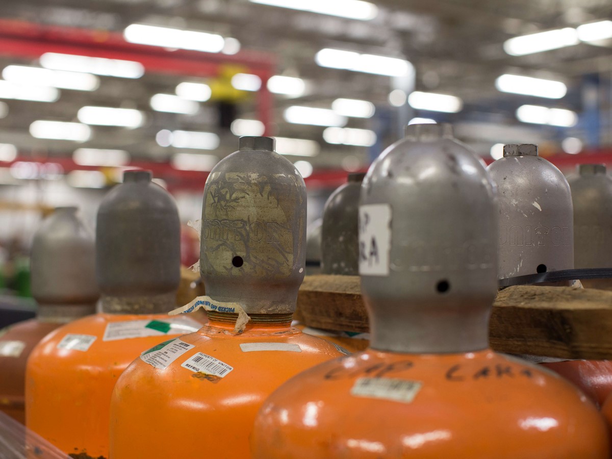 A close up of red cylinder heads in a row